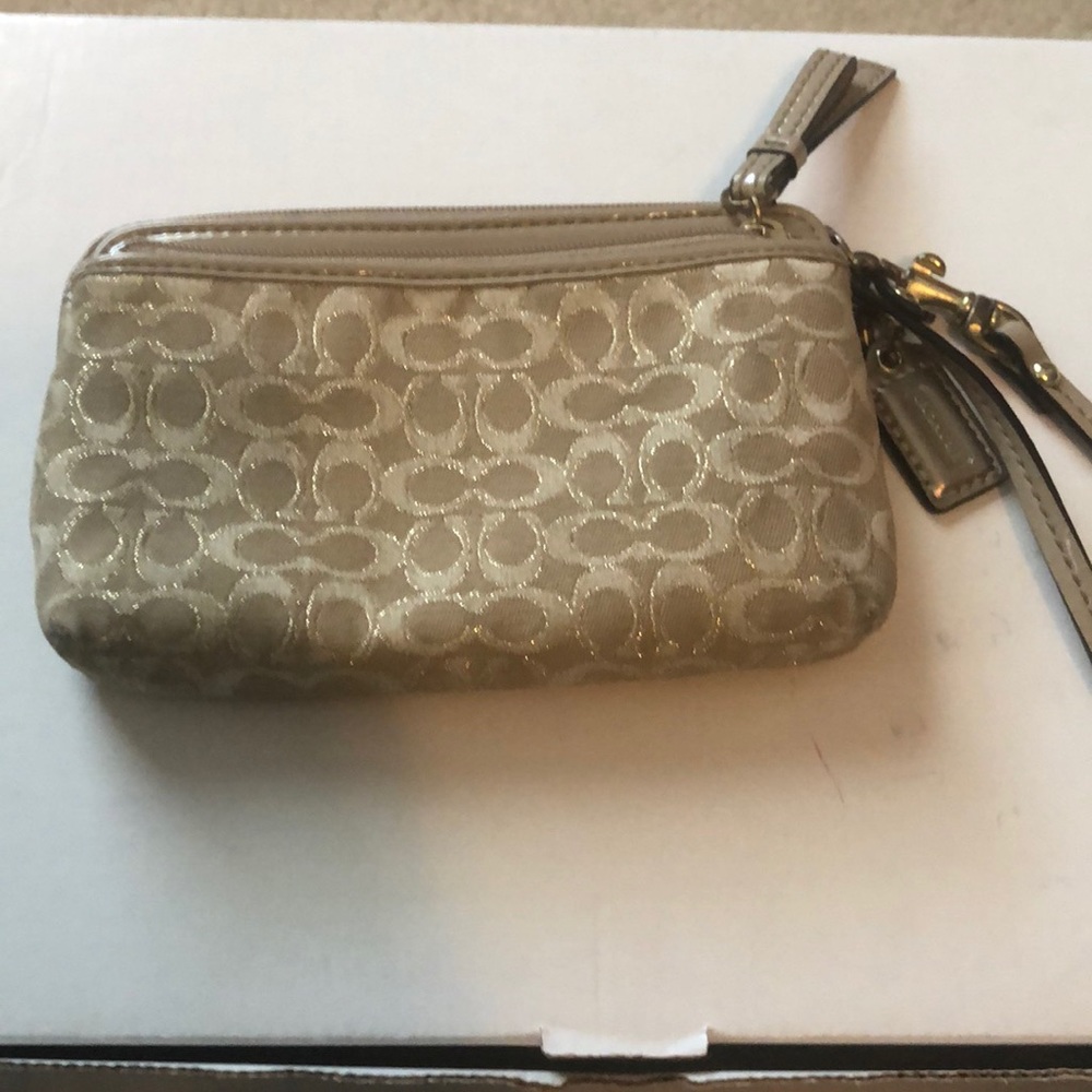 Coach wristlet. Tan /purple inside.